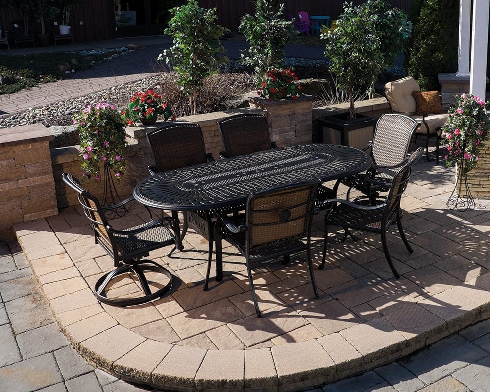 Black Cornwall table and chairs set on a patio.