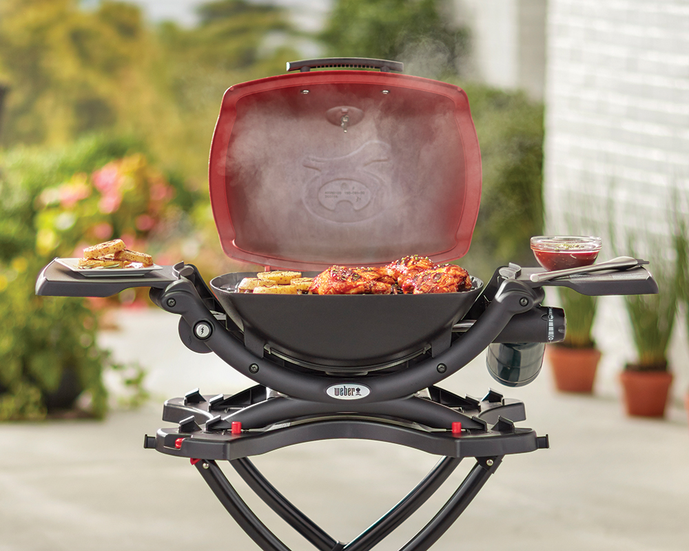 https://www.greenacres.info/wp-content/uploads/2016/07/Weber-Q-1200-Red-Lifestyle-Image.jpg