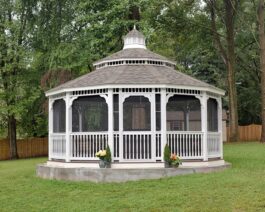 20' Dodecagon White Vinyl Gazebo in backyard.