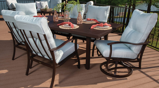 Albany Dining Set with light blue cushions on a patio.