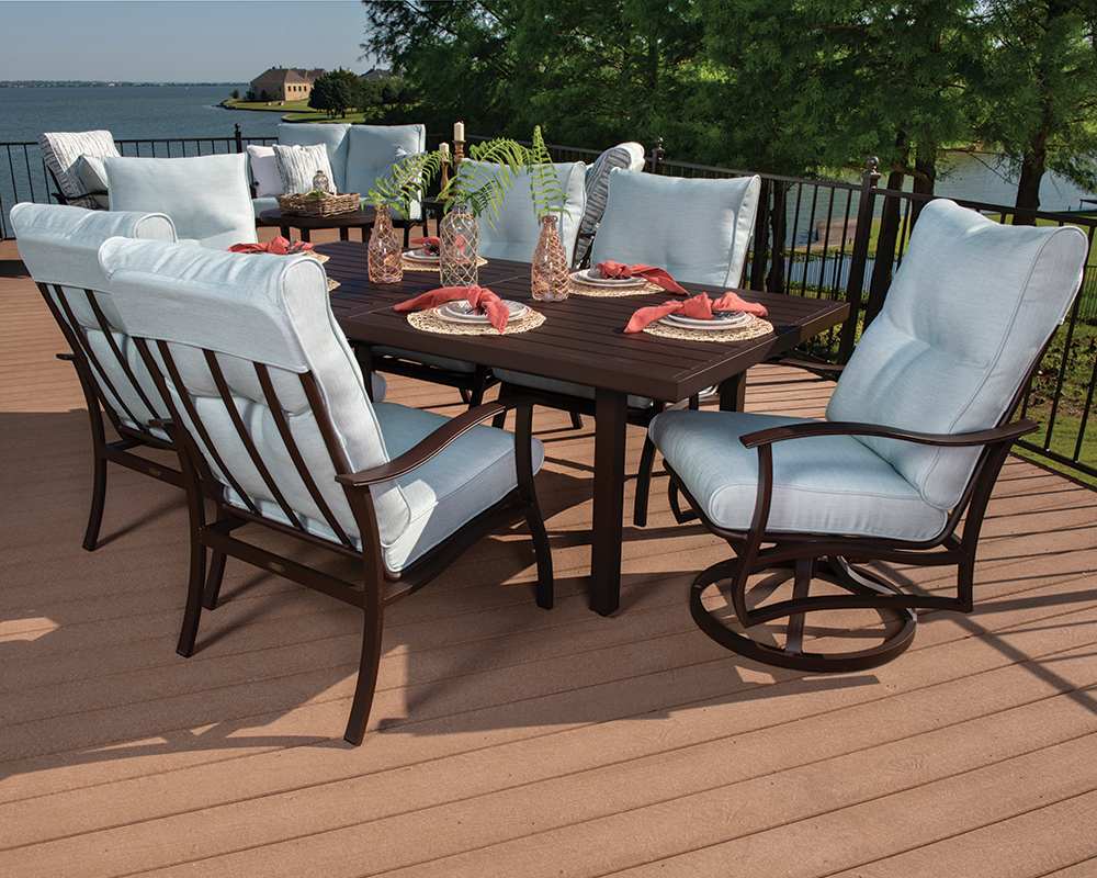 Albany Dining Set with light blue cushions on a patio.