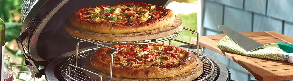 Pizza cooking on a Big Green Egg cooking rack extender set.