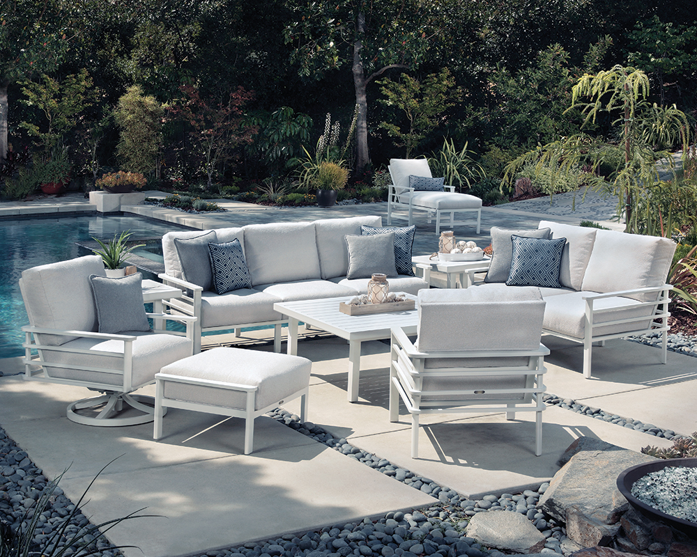 Sarasota sofa, loveseat, lounge chair, swivel lounge chair and ottoman around a fire pit.