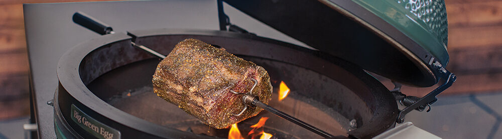 Rotisserie Kit for XL Egg with a roast on it.