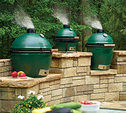Big Green Egg grills on a patio.