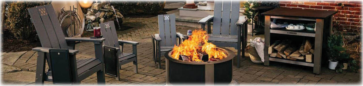 Breeo Corten fire pit with two adult fire pit chairs and two kids fire pit chairs and fire table.
