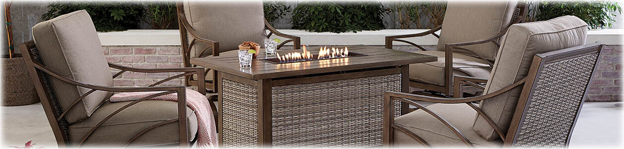 Potomac rectangular fire pit with four Potomac lounge chairs.