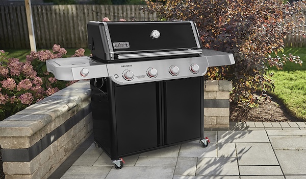 Gas grill delivered to backyard patio.