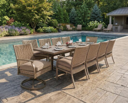 Trenton II 40x87 Ext Table Set on a patio next to a pool.